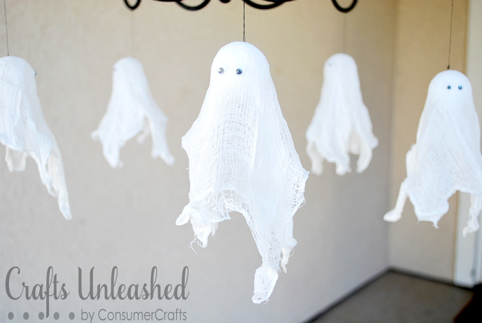 Hanging cheesecloth ghosts | 25+ Halloween party decor ideas