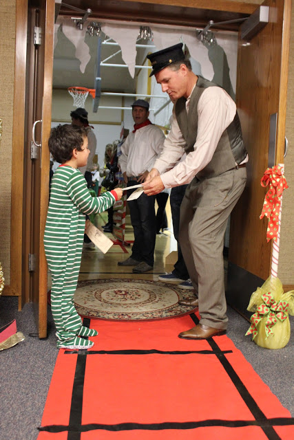 Conductor Taking Tickets | 25+ Polar Express Party Ideas
