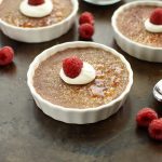chocolate creme brulee with whipped cream and fresh raspberries