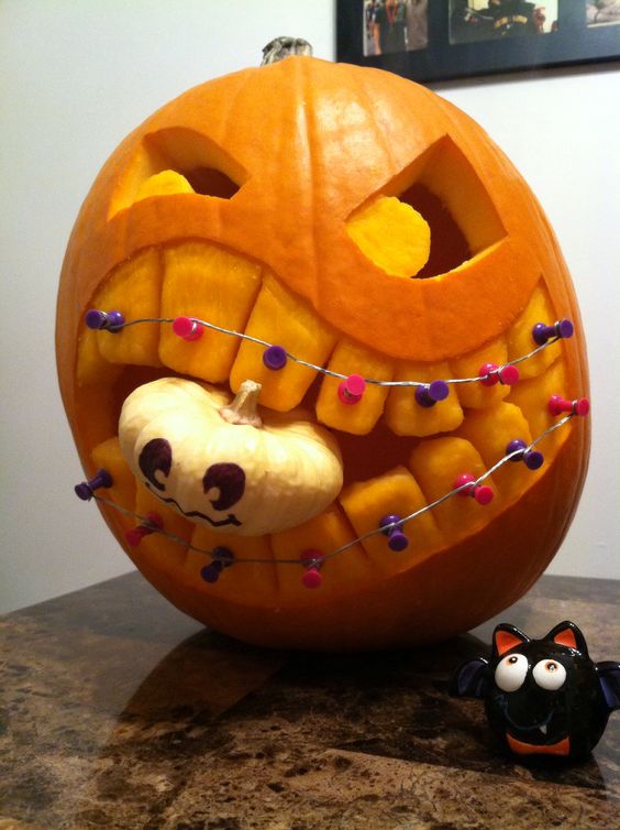 Braces and Baby Carved Pumpkin | 25+ Creative Carved Pumpkins